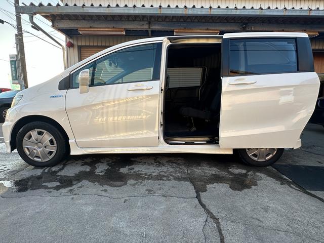 フリードスパイクハイブリッド ジャストセレクション　車検整備付き　Ｓキー　キーフリー　セキュリティーアラーム　横滑り防止機能　エアコン　フルフラットシート　パワーステアリング　クルーズコントロール　Ｉ－ＳＴＯＰ　パワーウィンドウ　運転席エアバッグ（20枚目）