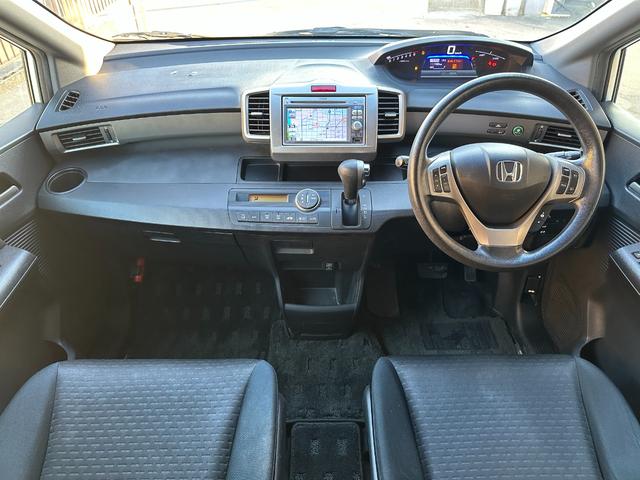 フリードスパイクハイブリッド ジャストセレクション　車検整備付き　Ｓキー　キーフリー　セキュリティーアラーム　横滑り防止機能　エアコン　フルフラットシート　パワーステアリング　クルーズコントロール　Ｉ－ＳＴＯＰ　パワーウィンドウ　運転席エアバッグ（23枚目）