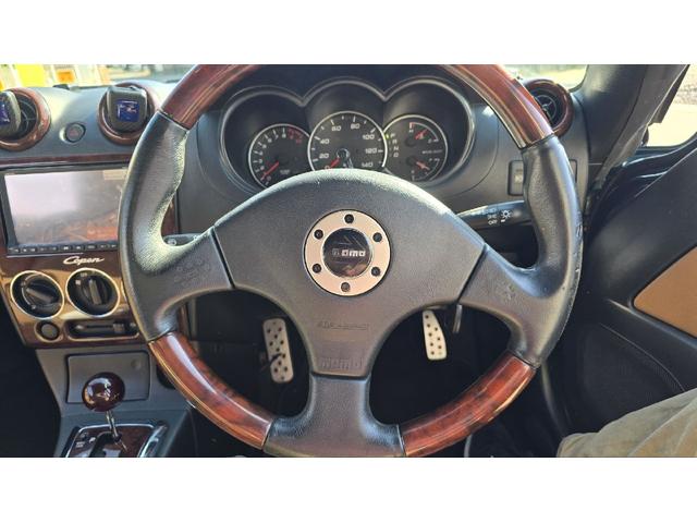 コペン タンレザーエディション　ＥＴＣ　ナビ　ＴＶ　キーレスエントリー　シートヒーター　ＡＴ　ＡＢＳ　電動オープンカー　革シート　アルミホイール　エアコン　パワーステアリング　パワーウィンドウ　ＭＯＭＯステアリング　スポイラー（3枚目）