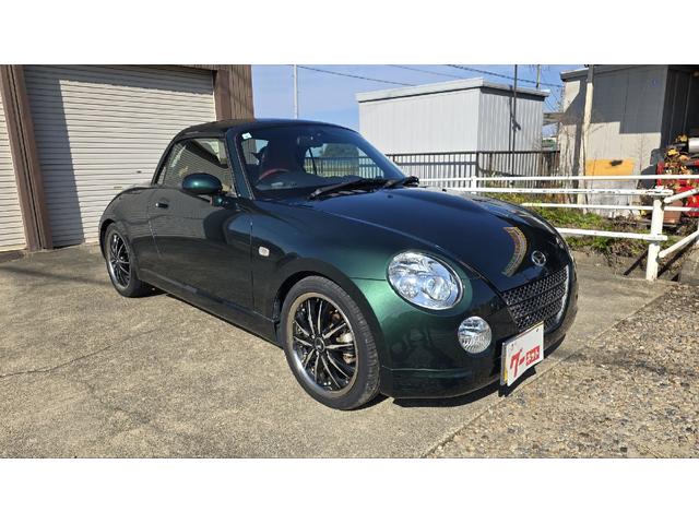 コペン タンレザーエディション　ＥＴＣ　ナビ　ＴＶ　キーレスエントリー　シートヒーター　ＡＴ　ＡＢＳ　電動オープンカー　革シート　アルミホイール　エアコン　パワーステアリング　パワーウィンドウ　ＭＯＭＯステアリング　スポイラー（13枚目）