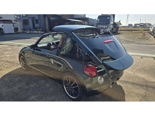 コペン タンレザーエディション　ＥＴＣ　ナビ　ＴＶ　キーレスエントリー　シートヒーター　ＡＴ　ＡＢＳ　電動オープンカー　革シート　アルミホイール　エアコン　パワーステアリング　パワーウィンドウ　ＭＯＭＯステアリング　スポイラー（26枚目）