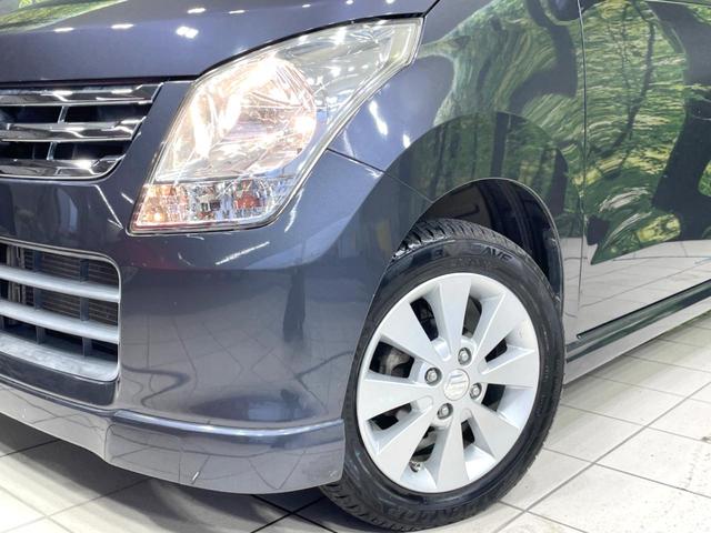 ワゴンR FXリミテッドII 特別仕様車 禁煙車 スマートキー ビルトインETC オートエアコン 純正14インチアルミ 電動格納ドアミラー 革巻きステアリング セキュリティーアラーム 運転席シートリフター CD再生/6スピーカー(12枚目)