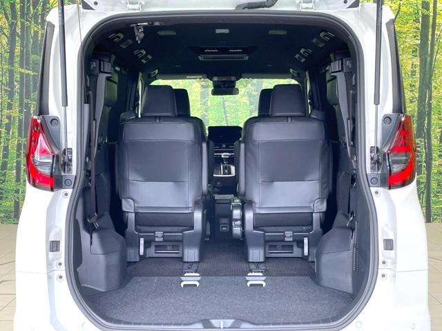 ノア ハイブリッドＳ－Ｚ　禁煙車　後席モニター　両側電動ドア　衝突軽減　純正１０．５型ディスプレイ　バックカメラ　ＥＴＣ　レーダークルーズ　コーナーセンサー　シートヒーター　車線逸脱警報　ＬＥＤヘッド　オートライト　フルセグ（64枚目）