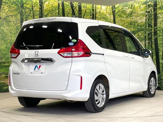 フリード Ｇ・ホンダセンシング　両側電動ドア　純正ＳＤナビ　バックカメラ　寒冷地仕様　衝突被害軽減システム　禁煙車　コーナーセンサー　スマートキー　ＬＥＤヘッド　ビルトインＥＴＣ　オートハイビーム　車線逸脱警報　オートライト（18枚目）