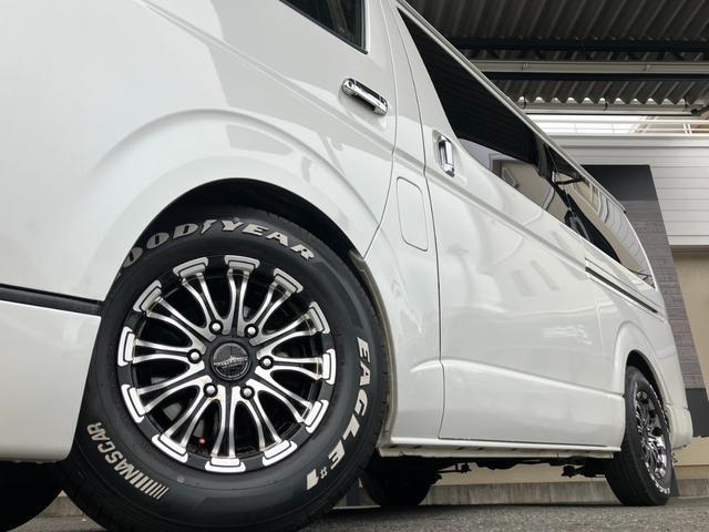 ハイエースバン ロングスーパーGL ローダウン/コブラFスポイラー/バトルシップ15inアルミ/GR8シートカバー/純正7inナビ/ETC/Bカメラ/天吊モニター/LEDテールランプ/スマートキー/ベッドキット/LEDヘッドライト(2枚目)