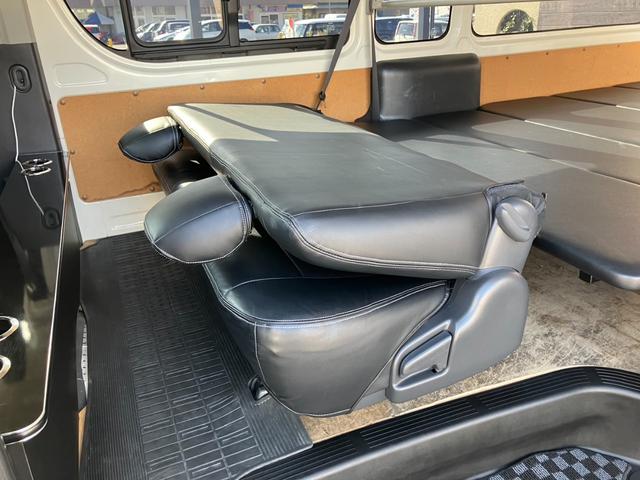 ハイエースバン ＳロングワイドＤＸ　ＧＬパッケージ　４ＷＤ／ハイルーフ５人乗／ナビＴＶ／Ｂカメラ／天吊モニタ／天井スピーカー／社外アルミ／ＧＲ８エアロ／ベッドキット（58枚目）