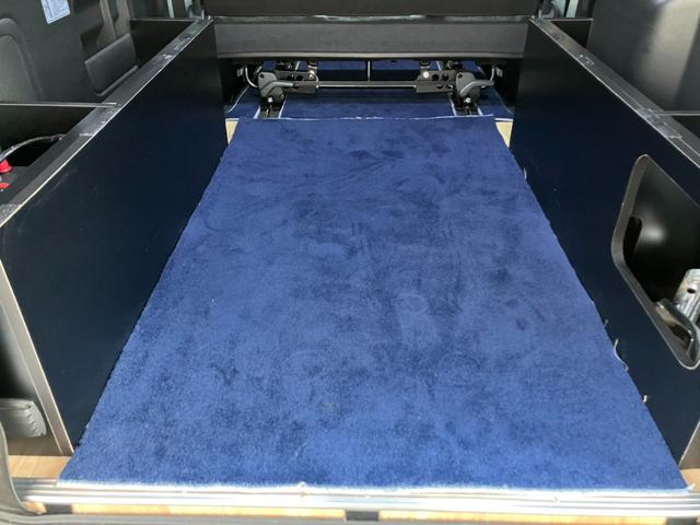 ハイエースバン スーパーGL ダークプライムII 4WD/ボディラッピングカーキ/BIG-Xナビ/天吊りモニタ/Bカメラ/サブバッテリー/ベッドキット/セカンドテーブル/社外デジタルミラー/社外アルミ/LEDヘッド/ルーフキャリア/外部電源あり(57枚目)