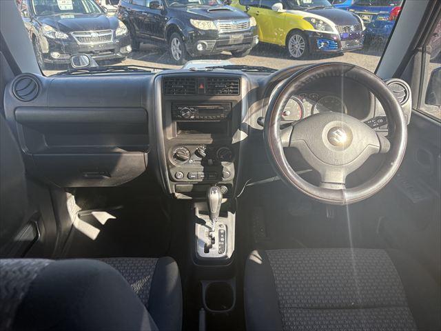 ジムニー ＸＧ　４ＷＤ　ターボ　ＡＴ　オーディオ　ヘットライトレベライザー　パワーウィンドウ　シートヒーター　エアバック　エアコン　社外アルミホイール（13枚目）