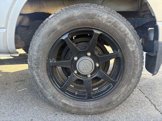 ジムニー ＸＧ　４ＷＤ　ターボ　ＡＴ　オーディオ　ヘットライトレベライザー　パワーウィンドウ　シートヒーター　エアバック　エアコン　社外アルミホイール（43枚目）