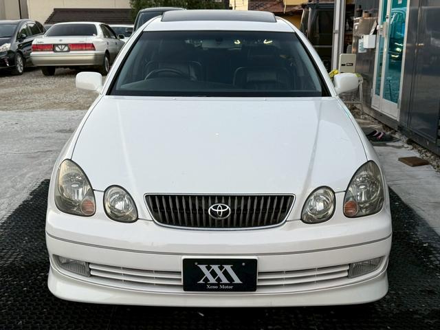 アリスト V300ベルテックスエディション 禁煙車 タイミングベルト交換済 サンルーフ 黒革シート フルエアロ HKS車高調 ブリッツマフラー クスコタワーバー ターボタイマー イカリングヘッド LEDテール 16インチメッキアルミ 純正ナビ(21枚目)