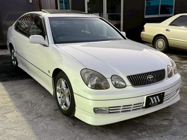 アリスト V300ベルテックスエディション 禁煙車 タイミングベルト交換済 サンルーフ 黒革シート フルエアロ HKS車高調 ブリッツマフラー クスコタワーバー ターボタイマー イカリングヘッド LEDテール 16インチメッキアルミ 純正ナビ(25枚目)