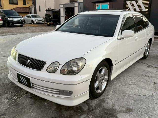 アリスト V300ベルテックスエディション 禁煙車 タイミングベルト交換済 サンルーフ 黒革シート フルエアロ HKS車高調 ブリッツマフラー クスコタワーバー ターボタイマー イカリングヘッド LEDテール 16インチメッキアルミ 純正ナビ(26枚目)