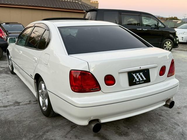 アリスト V300ベルテックスエディション 禁煙車 タイミングベルト交換済 サンルーフ 黒革シート フルエアロ HKS車高調 ブリッツマフラー クスコタワーバー ターボタイマー イカリングヘッド LEDテール 16インチメッキアルミ 純正ナビ(27枚目)