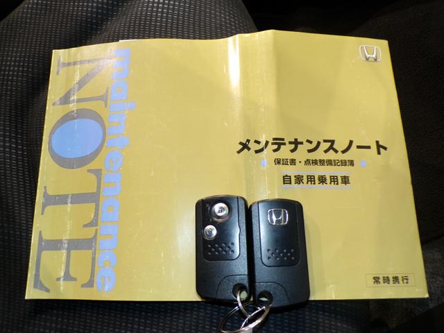 フィット G・10thアニバーサリー ETCインターナビワンセグTVスマートキー 盗難防止システム DVD再生 TVナビ エアコン 運転席エアバッグ Wエアバッグ ABS パワーウィンドウ キーレスエントリー パワーステアリング 禁煙(23枚目)
