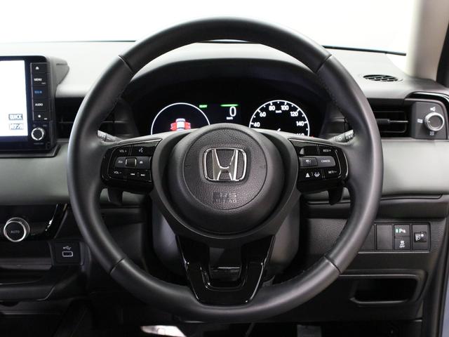 ヴェゼル e:HEVX・HuNTパッケージ 当社試乗車 純正9型ナビ 専用エクステリア ルーフレール 渋滞追従クルーズ 電子パーキング ブレーキホールド 車線維持支援 パーキングセンサー オートハイビーム 純正16AW 本革巻ステアリング 禁煙(12枚目)