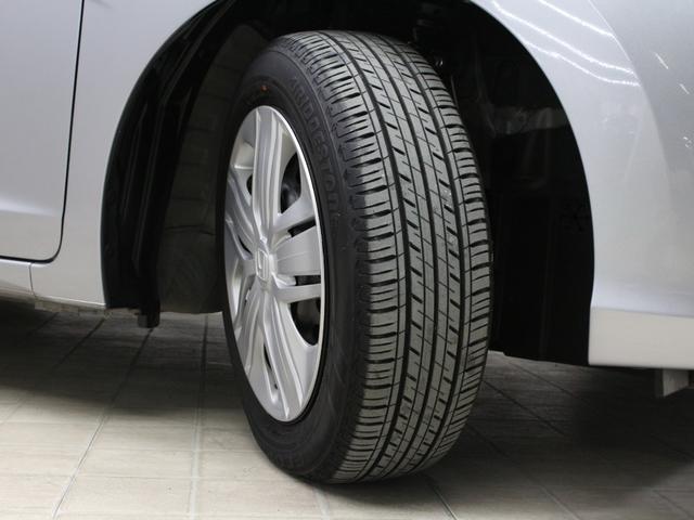 フィット 13G・Lホンダセンシング 衝突軽減ブレーキ 純正ナ LEDヘッド&フォグ アダプティブクルーズ 車線維持支援 誤発進抑制装置 ワンオーナー 禁煙車 Bluetooth ステアリングリモコン ドアバイザー アイドリングストップ(26枚目)