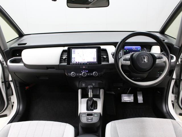 フィット ｅ：ＨＥＶホーム　純正８型ナビ　前後ドラレコ　渋滞追従クルーズ　電子パーキング　パーキングセンサー　ブレーキホールド　オートハイビーム　ワンオーナー　ハーフレザー　本革巻ステアリング　純正１６ＡＷ　Ｂｌｕｅｔｏｏｔｈ（5枚目）