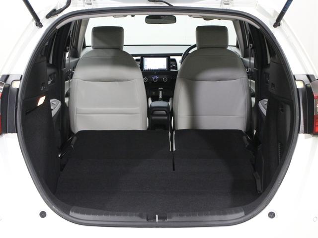 フィット ｅ：ＨＥＶホーム　純正８型ナビ　前後ドラレコ　渋滞追従クルーズ　電子パーキング　パーキングセンサー　ブレーキホールド　オートハイビーム　ワンオーナー　ハーフレザー　本革巻ステアリング　純正１６ＡＷ　Ｂｌｕｅｔｏｏｔｈ（18枚目）