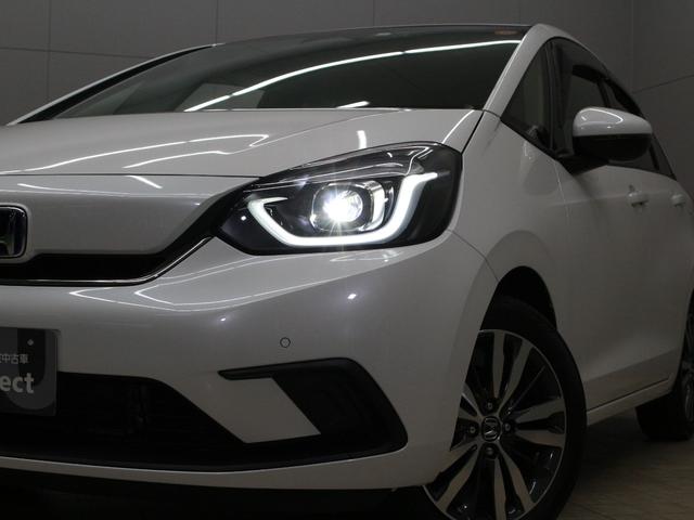 フィット ｅ：ＨＥＶホーム　純正８型ナビ　前後ドラレコ　渋滞追従クルーズ　電子パーキング　パーキングセンサー　ブレーキホールド　オートハイビーム　ワンオーナー　ハーフレザー　本革巻ステアリング　純正１６ＡＷ　Ｂｌｕｅｔｏｏｔｈ（20枚目）