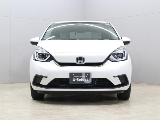 フィット ｅ：ＨＥＶホーム　純正８型ナビ　前後ドラレコ　渋滞追従クルーズ　電子パーキング　パーキングセンサー　ブレーキホールド　オートハイビーム　ワンオーナー　ハーフレザー　本革巻ステアリング　純正１６ＡＷ　Ｂｌｕｅｔｏｏｔｈ（21枚目）