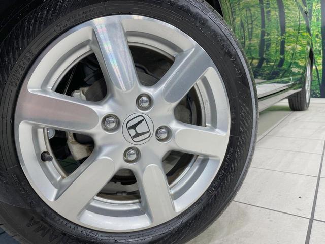 Ｎ－ＯＮＥ プレミアム・Ｌパッケージ　純正ナビ　バックカメラ　禁煙車　スマートキー　ＨＩＤヘッド　ＥＴＣ　純正１４インチアルミ　オートライト　オートエアコン　Ｂｌｕｅｔｏｏｔｈ　ＣＤ　ＤＶＤ　革巻きステアリング　盗難防止装置（13枚目）