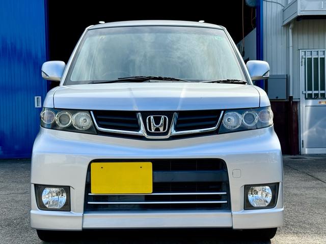 ゼストスパーク Ｗ　車検２年付き　禁煙車　カーナビ　フルセグＴＶ　ＤＶＤ　ＣＤ　スマートキー　プロジェクターＨＩＤヘッド　フォグランプ　ウインカーミラー　メッキグリル　リアウィング（3枚目）