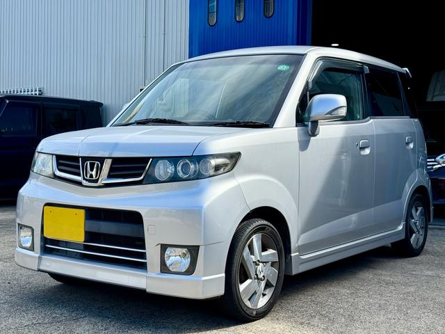 ゼストスパーク Ｗ　車検２年付き　禁煙車　カーナビ　フルセグＴＶ　ＤＶＤ　ＣＤ　スマートキー　プロジェクターＨＩＤヘッド　フォグランプ　ウインカーミラー　メッキグリル　リアウィング（10枚目）