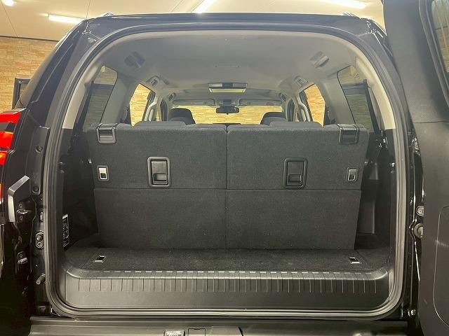 ランドクルーザープラド ＴＸ　リフトアップ　社外１７インチアルミ　オールテレーンタイヤ　　サンルーフ　１１型アルパインフローティングナビ　バックカメラ　後席フリップダウンモニター　７人乗　追従クルーズコントロール　レーンアシスト（64枚目）