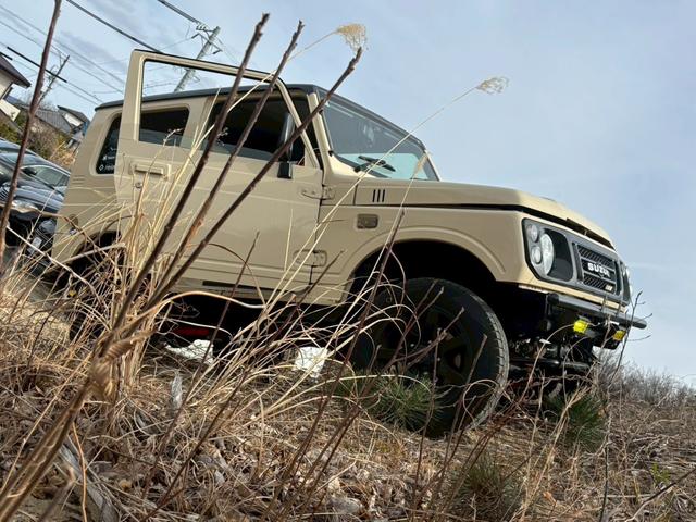 ジムニー ワイルドウインド　禁煙車・リフトアップ・社外サス・社外ショック・社外ラテラル・社外ロアアーム・社外マフラーＨＫＳ・社外前後バンパー・ナルディハンドル・インパネ木目使用・デジタルインナーミラー・ＥＴＣ・シートカバー・全塗（67枚目）