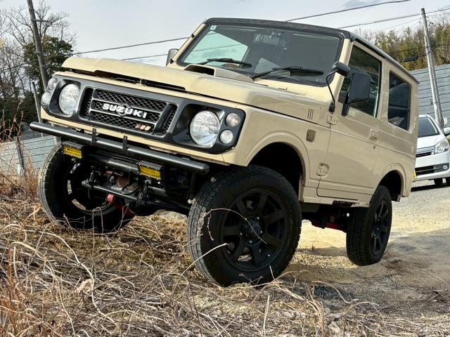 ジムニー ワイルドウインド　禁煙車・リフトアップ・社外サス・社外ショック・社外ラテラル・社外ロアアーム・社外マフラーＨＫＳ・社外前後バンパー・ナルディハンドル・インパネ木目使用・デジタルインナーミラー・ＥＴＣ・シートカバー・全塗（68枚目）