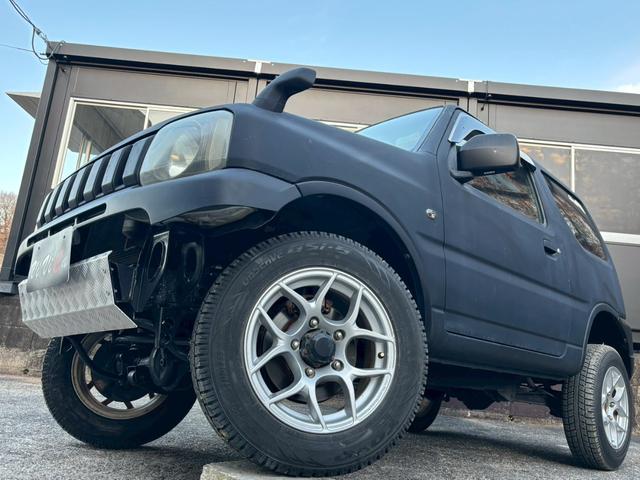 ジムニー FISフリースタイルワールドカップリミテッド 禁煙車・シートヒーター・スキッドガードバンパーアルミ縞板製・ETC・LEDヘッドライト・サイドバイザー・アルミホイール16インチ・カロッツェリアUSBオーディオ・トランスファーレバー(14枚目)