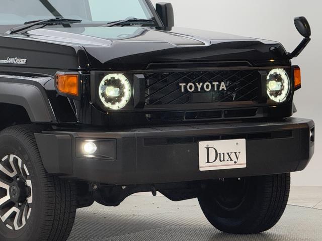 ランドクルーザー70 AX 【ナビ付き車両】 丸目ヘッドライト バックモニター内臓インナーミラー 電動デフロック 背面タイヤ リモコンキー ヒルスタートアシストコントロール ダウンヒルスタートコントロール 純正16インチAW(21枚目)
