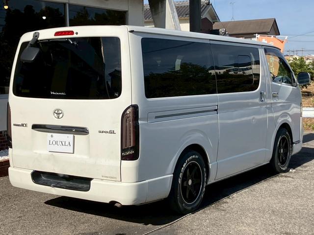 レジアスエースバン ロングスーパーＧＬ　フルフラットベットキッド　フロントエアロ　赤×黒ツートンレザー調シートカバー　ケンウッドナビ　フルセグＴＶ　Ｂｌｕｅｔｏｏｔｈ接続　社外ヘッドライト・テールライト　ＡＵＴＯライト　ＥＴＣ（14枚目）