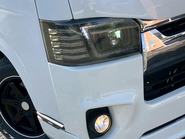 レジアスエースバン ロングスーパーＧＬ　フルフラットベットキッド　フロントエアロ　赤×黒ツートンレザー調シートカバー　ケンウッドナビ　フルセグＴＶ　Ｂｌｕｅｔｏｏｔｈ接続　社外ヘッドライト・テールライト　ＡＵＴＯライト　ＥＴＣ（18枚目）