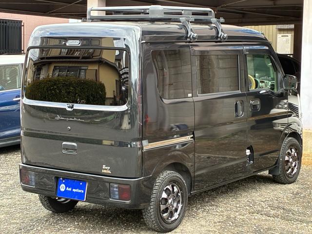 エブリイ ジョインターボ　禁煙　ナビ　バックモニター　ルーフキャリア　筆記体レトロ調エンブレム　ＭＡＤＣＲＯＳＳ／ＧＲＡＣＥ１４インチＡＷ　ジオランダーＸ－ＡＴ　ベッドキット　黒革調シートカバー　Ｂｌｕｅｔｏｏｔｈオーディオ（21枚目）