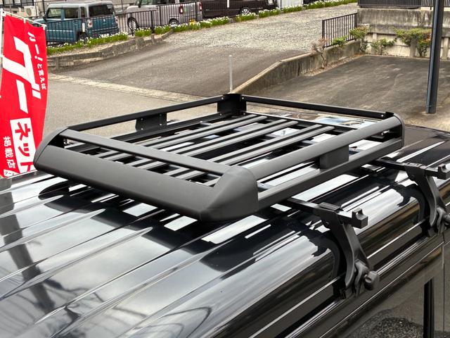 エブリイ ジョインターボ　禁煙　ナビ　バックモニター　ルーフキャリア　筆記体レトロ調エンブレム　ＭＡＤＣＲＯＳＳ／ＧＲＡＣＥ１４インチＡＷ　ジオランダーＸ－ＡＴ　ベッドキット　黒革調シートカバー　Ｂｌｕｅｔｏｏｔｈオーディオ（42枚目）
