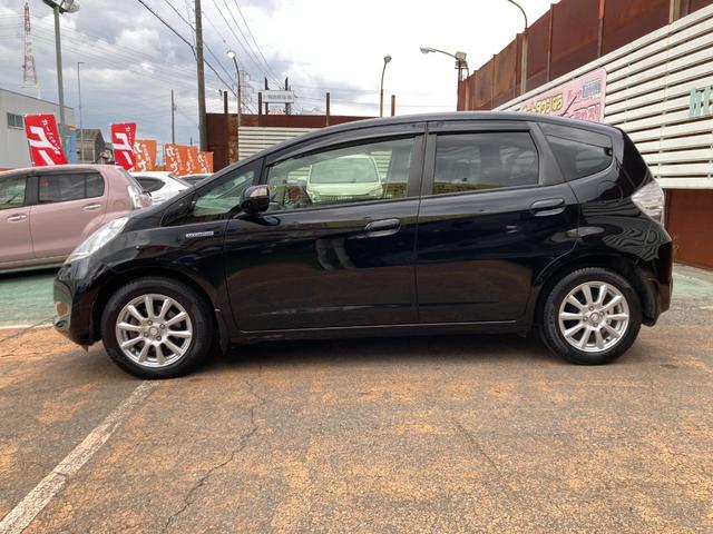 フィットハイブリッド スマートセレクション 後期モデル/車検2年+整備&保守付き/純正メモリーナビ(TV/CD/DVD/SD/USB)/バックカメラ/ETC/オートクルーズコントロール/HID(オートライト)/スマートキー/社外15インチアルミ(5枚目)