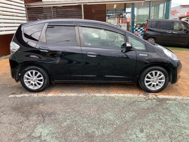 フィットハイブリッド スマートセレクション 後期モデル/車検2年+整備&保守付き/純正メモリーナビ(TV/CD/DVD/SD/USB)/バックカメラ/ETC/オートクルーズコントロール/HID(オートライト)/スマートキー/社外15インチアルミ(31枚目)