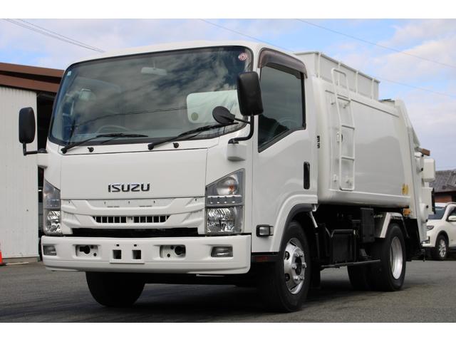 エルフトラック パッカー車/塵芥車 3.4t積載 6.5立米 回転式 新明和GR064-1634S2 巻込み式 連続積込 汚水タンク 電格ミラー サイドラダー 箱上キャリア スペアキー 車両総重量7995kg 荷台内寸4131-2051-1432(2枚目)