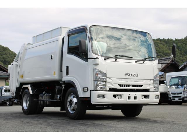 エルフトラック パッカー車/塵芥車 3.4t積載 6.5立米 回転式 新明和GR064-1634S2 巻込み式 連続積込 汚水タンク 電格ミラー サイドラダー 箱上キャリア スペアキー 車両総重量7995kg 荷台内寸4131-2051-1432(4枚目)
