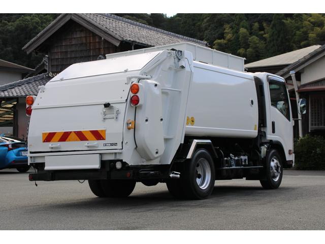 エルフトラック パッカー車/塵芥車 3.4t積載 6.5立米 回転式 新明和GR064-1634S2 巻込み式 連続積込 汚水タンク 電格ミラー サイドラダー 箱上キャリア スペアキー 車両総重量7995kg 荷台内寸4131-2051-1432(6枚目)