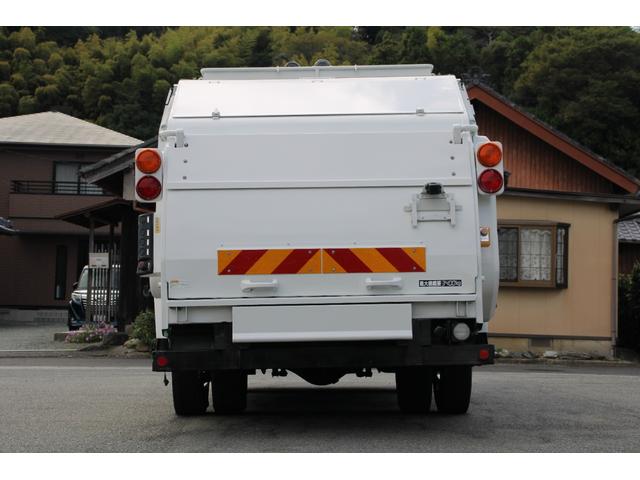 エルフトラック パッカー車/塵芥車 3.4t積載 6.5立米 回転式 新明和GR064-1634S2 巻込み式 連続積込 汚水タンク 電格ミラー サイドラダー 箱上キャリア スペアキー 車両総重量7995kg 荷台内寸4131-2051-1432(7枚目)