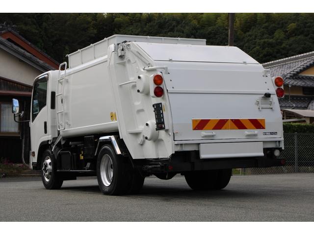 エルフトラック パッカー車/塵芥車 3.4t積載 6.5立米 回転式 新明和GR064-1634S2 巻込み式 連続積込 汚水タンク 電格ミラー サイドラダー 箱上キャリア スペアキー 車両総重量7995kg 荷台内寸4131-2051-1432(8枚目)