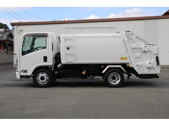 エルフトラック パッカー車/塵芥車 3.4t積載 6.5立米 回転式 新明和GR064-1634S2 巻込み式 連続積込 汚水タンク 電格ミラー サイドラダー 箱上キャリア スペアキー 車両総重量7995kg 荷台内寸4131-2051-1432(9枚目)