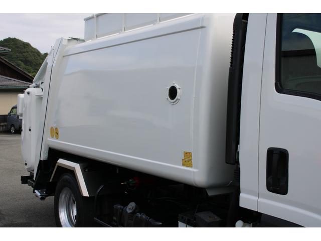 エルフトラック パッカー車/塵芥車 3.4t積載 6.5立米 回転式 新明和GR064-1634S2 巻込み式 連続積込 汚水タンク 電格ミラー サイドラダー 箱上キャリア スペアキー 車両総重量7995kg 荷台内寸4131-2051-1432(17枚目)