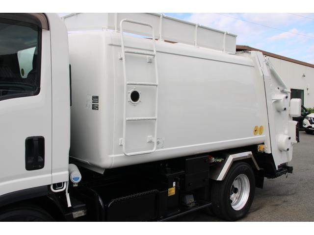 エルフトラック パッカー車/塵芥車 3.4t積載 6.5立米 回転式 新明和GR064-1634S2 巻込み式 連続積込 汚水タンク 電格ミラー サイドラダー 箱上キャリア スペアキー 車両総重量7995kg 荷台内寸4131-2051-1432(20枚目)