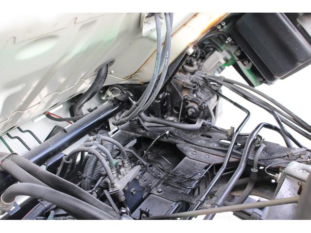 エルフトラック パッカー車/塵芥車 3.4t積載 6.5立米 回転式 新明和GR064-1634S2 巻込み式 連続積込 汚水タンク 電格ミラー サイドラダー 箱上キャリア スペアキー 車両総重量7995kg 荷台内寸4131-2051-1432(23枚目)