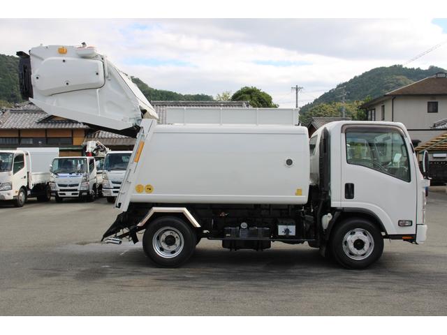 エルフトラック パッカー車/塵芥車 3.4t積載 6.5立米 回転式 新明和GR064-1634S2 巻込み式 連続積込 汚水タンク 電格ミラー サイドラダー 箱上キャリア スペアキー 車両総重量7995kg 荷台内寸4131-2051-1432(33枚目)