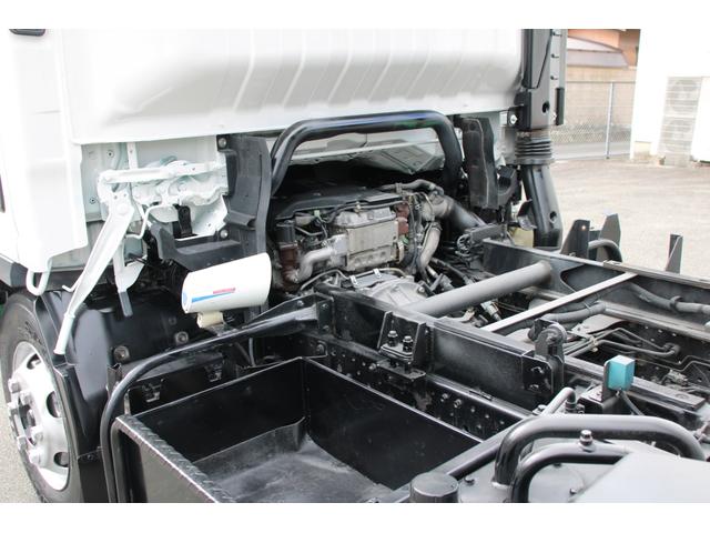 エルフトラック パッカー車/塵芥車 3.4t積載 6.5立米 回転式 新明和GR064-1634S2 巻込み式 連続積込 汚水タンク 電格ミラー サイドラダー 箱上キャリア スペアキー 車両総重量7995kg 荷台内寸4131-2051-1432(49枚目)