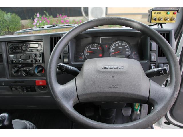 エルフトラック パッカー車/塵芥車 3.4t積載 6.5立米 回転式 新明和GR064-1634S2 巻込み式 連続積込 汚水タンク 電格ミラー サイドラダー 箱上キャリア スペアキー 車両総重量7995kg 荷台内寸4131-2051-1432(64枚目)